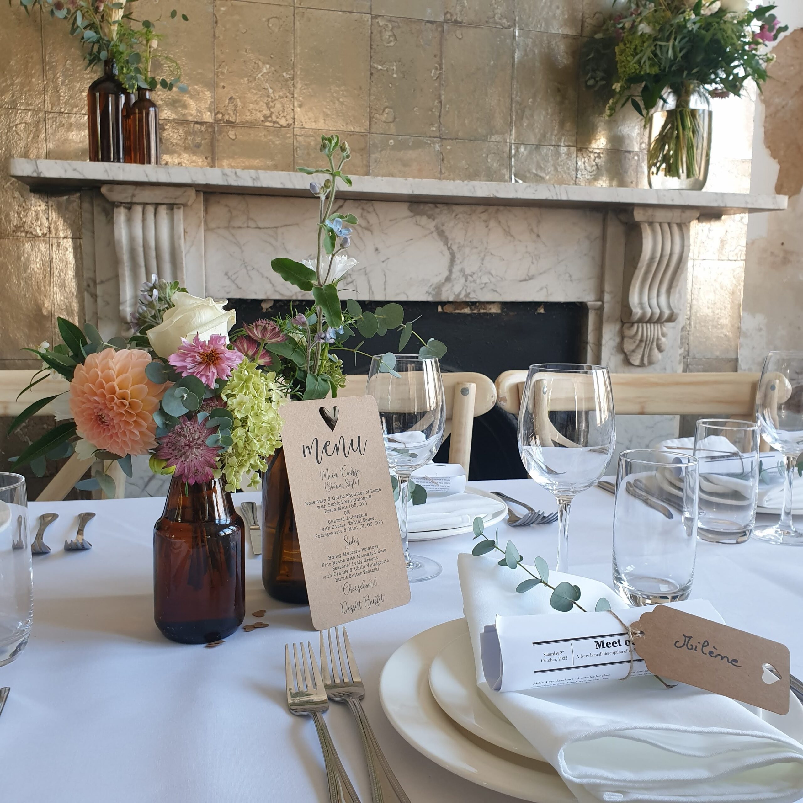 A wedding table with flowers and table wear